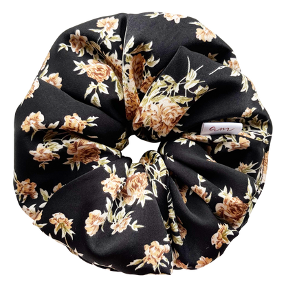 A picture of black floral oversized scrunchie.
